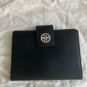 Tory Burch passport holder. Great condition- black leather includes dust bag